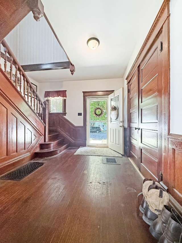 401 S Chestnut St, Shannon, IL 61078 - foyer featuring hardwood / wood-style flooring, stairway, and wainscoting