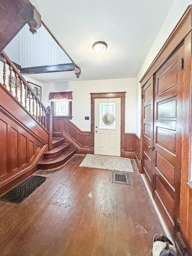 401 S Chestnut St, Shannon, IL 61078 - entrance foyer with stairs, wood-type flooring, a wainscoted wall, and healthy amount of natural light