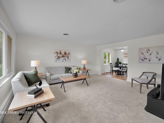 513 Chaney Ave, Crest Hill, IL 60403 - living room featuring carpet flooring and a baseboard heating unit