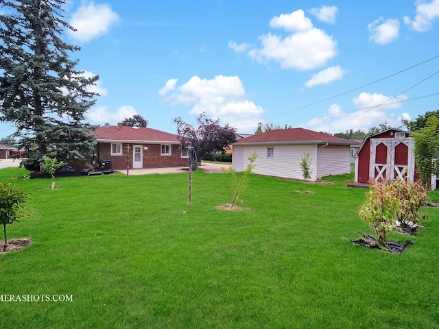 513 Chaney Ave, Crest Hill, IL 60403 - view of green lawn featuring a shed and a patio area