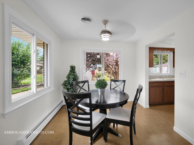 513 Chaney Ave, Crest Hill, IL 60403 - dining area featuring a baseboard radiator and healthy amount of natural light
