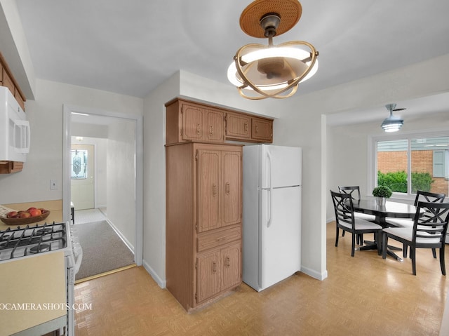 513 Chaney Ave, Crest Hill, IL 60403 - kitchen with white appliances and baseboards