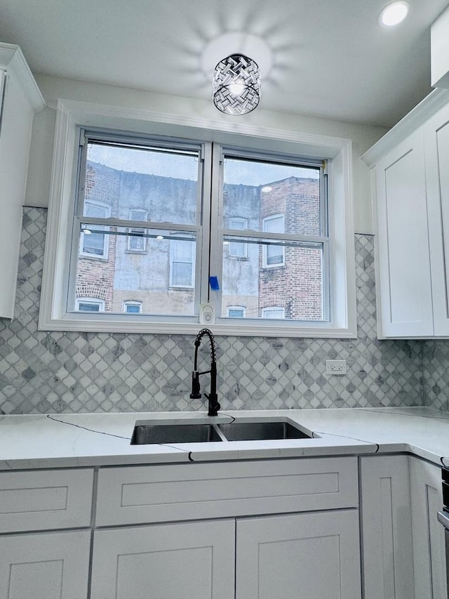 7253 S Marshfield Ave, Chicago, IL 60636 - kitchen with white cabinetry and backsplash