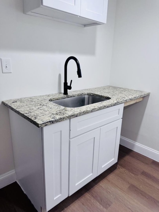 7253 S Marshfield Ave, Chicago, IL 60636 - kitchen with white cabinets, dark wood-style floors, and light stone counters