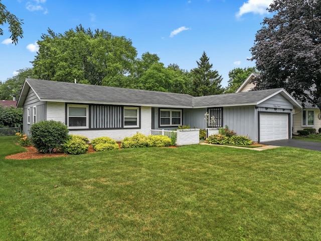 57 Kenilworth Ave, Elk Grove Village, IL 60007 - single story home with an attached garage, driveway, a front yard, and a shingled roof