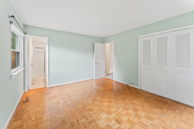 57 Kenilworth Ave, Elk Grove Village, IL 60007 - unfurnished bedroom featuring a closet and connected bathroom