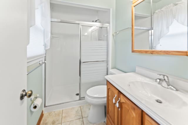57 Kenilworth Ave, Elk Grove Village, IL 60007 - full bathroom featuring vanity, a stall shower, and tile patterned floors