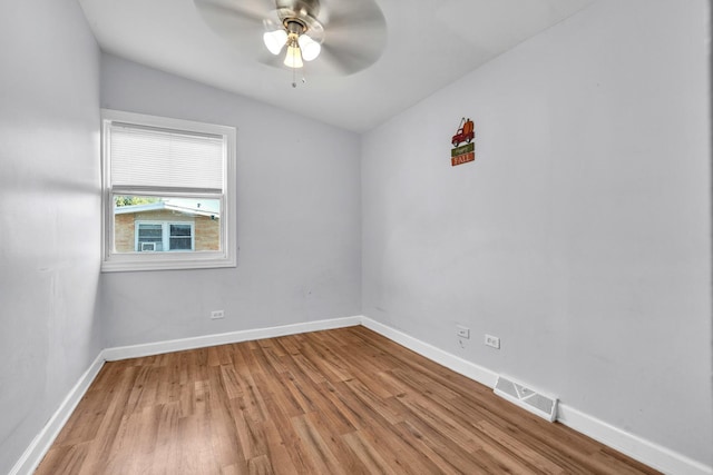 2059 Pine St Unit D, Des Plaines, IL 60018 - spare room with light wood-style floors, ceiling fan, and lofted ceiling