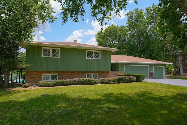 10S125 Springbrook Dr, Naperville, IL 60565 - split level home with an attached garage, a front lawn, driveway, brick siding, and board and batten siding