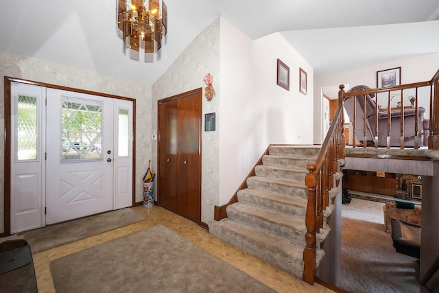 10S125 Springbrook Dr, Naperville, IL 60565 - entryway featuring stairs, lofted ceiling, and a chandelier
