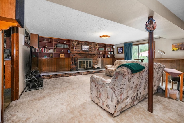 10S125 Springbrook Dr, Naperville, IL 60565 - living room with carpet floors, wooden walls, a textured ceiling, a brick fireplace, and built in shelves