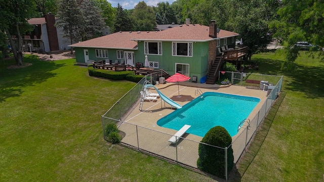 10S125 Springbrook Dr, Naperville, IL 60565 - view of pool with a water slide, stairway, a fenced backyard, a diving board, and a wooden deck