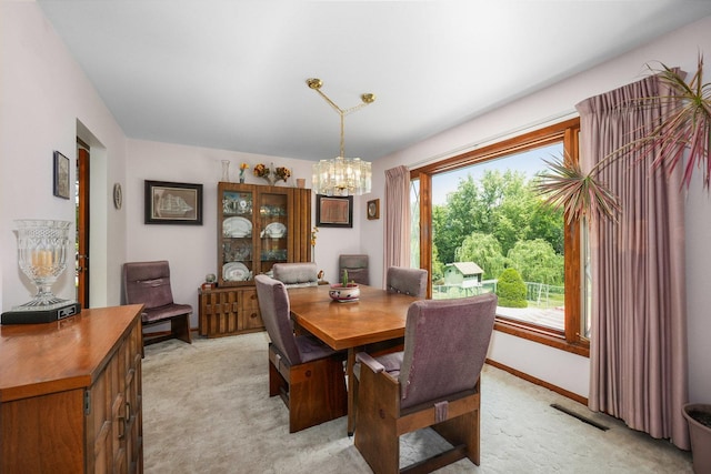 10S125 Springbrook Dr, Naperville, IL 60565 - dining area with light colored carpet and a chandelier
