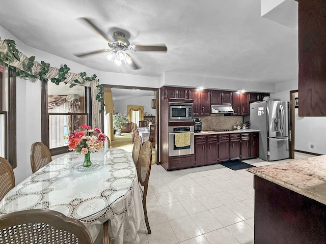 1607 Parkside Ct, Freeport, IL 61032 - kitchen featuring stainless steel appliances, light countertops, ceiling fan, backsplash, and under cabinet range hood