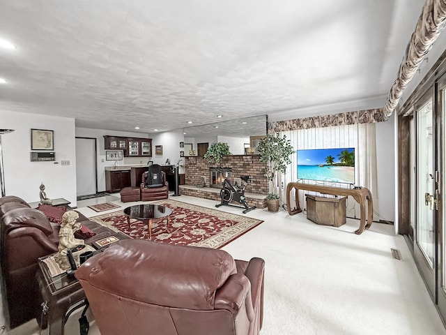 1607 Parkside Ct, Freeport, IL 61032 - living room with healthy amount of natural light, a fireplace, light carpet, and recessed lighting