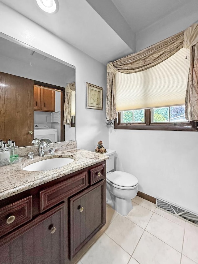 1607 Parkside Ct, Freeport, IL 61032 - bathroom with washer and clothes dryer, vanity, and tile patterned flooring