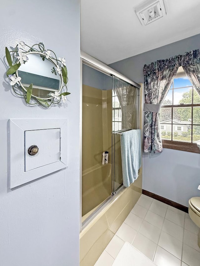 1607 Parkside Ct, Freeport, IL 61032 - bathroom with shower / bath combination with glass door and tile patterned floors