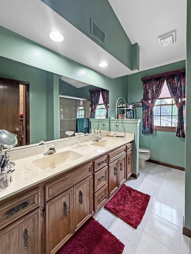 1607 Parkside Ct, Freeport, IL 61032 - bathroom featuring a stall shower, double vanity, and tile patterned flooring