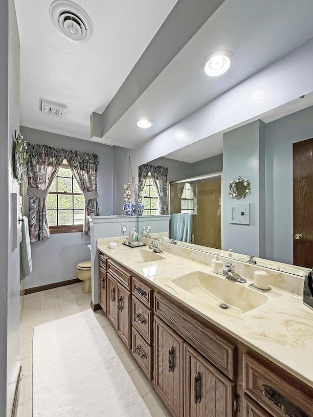 1607 Parkside Ct, Freeport, IL 61032 - full bathroom featuring double vanity, tile patterned flooring, and a stall shower