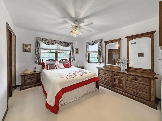1607 Parkside Ct, Freeport, IL 61032 - bedroom with light colored carpet and ceiling fan