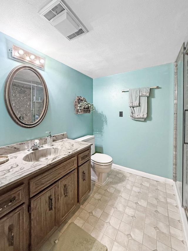 1607 Parkside Ct, Freeport, IL 61032 - bathroom featuring vanity, a stall shower, and a textured ceiling