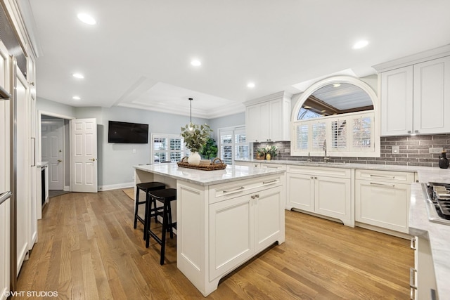 1604 Burr Ridge Clb, Burr Ridge, IL 60527 - kitchen with tasteful backsplash, light wood finished floors, a kitchen island, healthy amount of natural light, and recessed lighting
