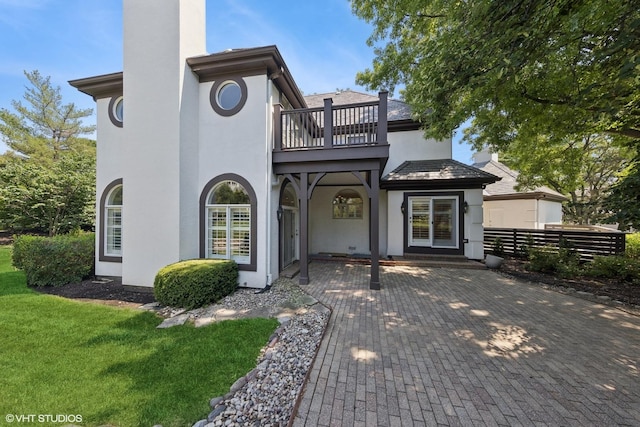1604 Burr Ridge Clb, Burr Ridge, IL 60527 - view of front of home with a balcony, stucco siding, and a chimney