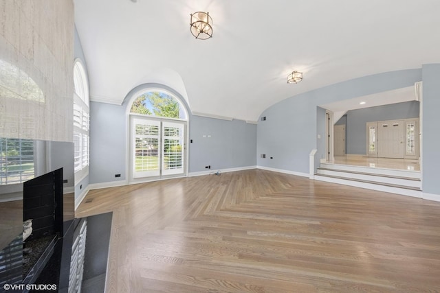 1604 Burr Ridge Clb, Burr Ridge, IL 60527 - unfurnished living room featuring a multi sided fireplace and vaulted ceiling