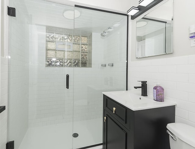 5848 N Drake Ave, Chicago, IL 60659 - full bathroom with tile walls, vanity, and a stall shower