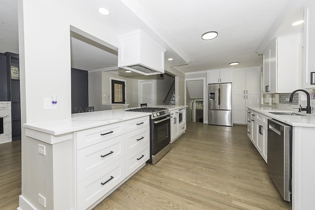 5848 N Drake Ave, Chicago, IL 60659 - kitchen with stainless steel appliances, white cabinetry, light wood finished floors, crown molding, and tasteful backsplash