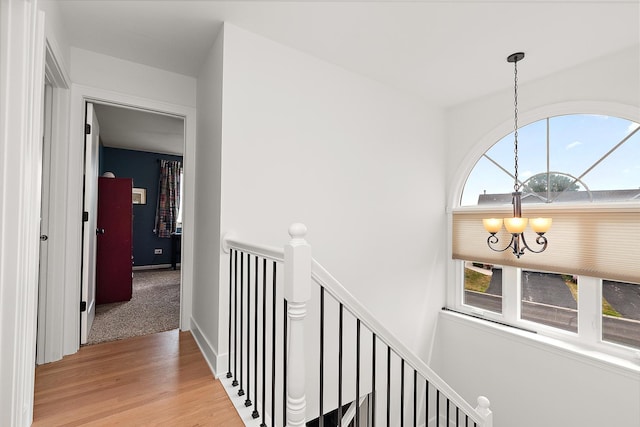 8378 Dunmore Dr, Tinley Park, IL 60487 - hall with a chandelier, an upstairs landing, and light wood-style floors