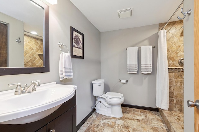 8378 Dunmore Dr, Tinley Park, IL 60487 - bathroom featuring vanity, stone finish floors, and a tile shower