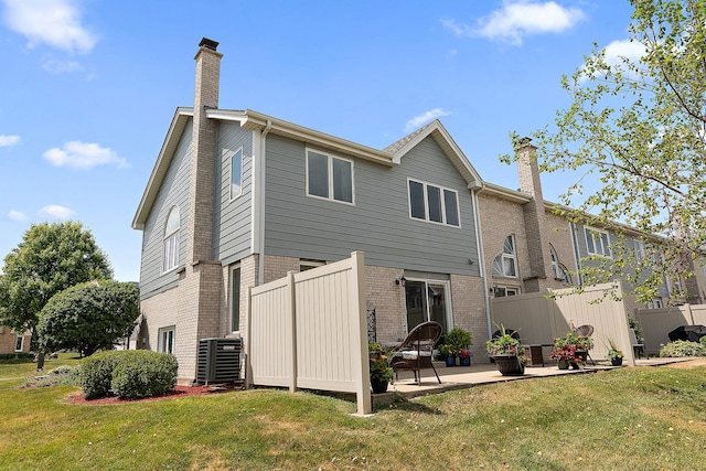8378 Dunmore Dr, Tinley Park, IL 60487 - rear view of house featuring a chimney, brick siding, and a patio area