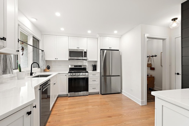 8378 Dunmore Dr, Tinley Park, IL 60487 - kitchen with appliances with stainless steel finishes, decorative backsplash, light countertops, white cabinets, and recessed lighting