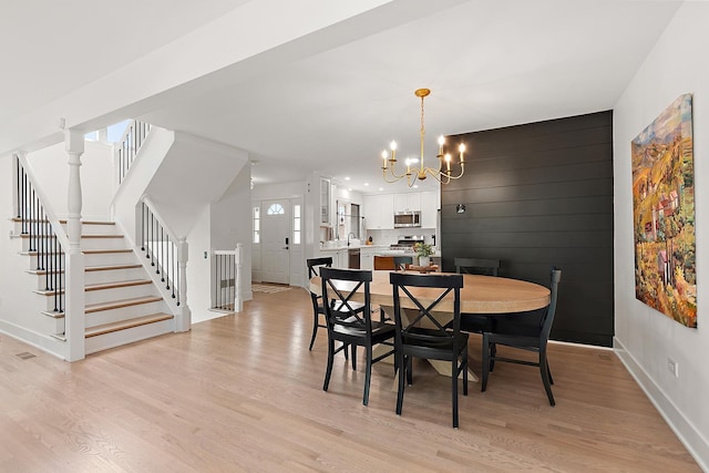 8378 Dunmore Dr, Tinley Park, IL 60487 - dining space with a chandelier, light wood-type flooring, stairs, and recessed lighting