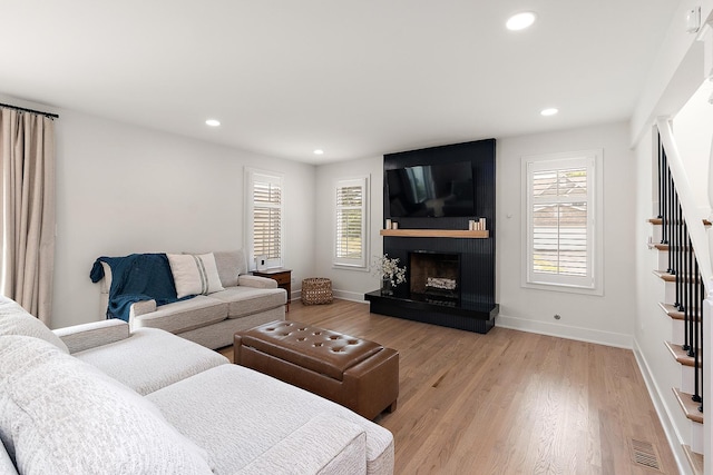 8378 Dunmore Dr, Tinley Park, IL 60487 - living area with stairway, recessed lighting, a fireplace, and light wood-style flooring
