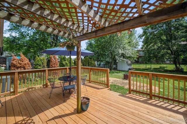 1885 Monday Dr, Elgin, IL 60123 - wooden terrace featuring outdoor dining space, a storage unit, a pergola, and a fenced backyard