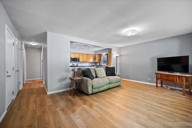 1885 Monday Dr, Elgin, IL 60123 - living area with wood finished floors and a textured ceiling