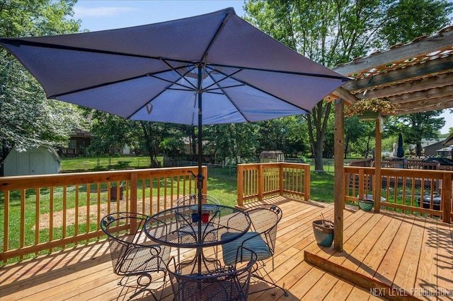 1885 Monday Dr, Elgin, IL 60123 - wooden terrace featuring a shed, a fenced backyard, and outdoor dining area