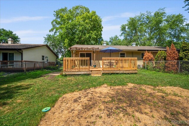 1885 Monday Dr, Elgin, IL 60123 - rear view of house with a fenced backyard, a wooden deck, and board and batten siding