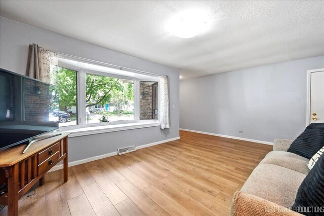 1885 Monday Dr, Elgin, IL 60123 - sitting room featuring light wood-type flooring and baseboards