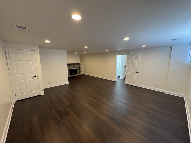 19W286 Governors Trl Unit 0, Oak Brook, IL 60523 - finished basement with dark wood finished floors, recessed lighting, and a fireplace