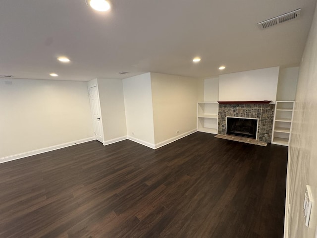 19W286 Governors Trl Unit 0, Oak Brook, IL 60523 - unfurnished living room with recessed lighting, dark wood finished floors, and a fireplace