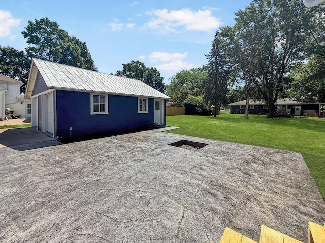 309 W S St, Pearl City, IL 61062 - view of patio / terrace with a garage