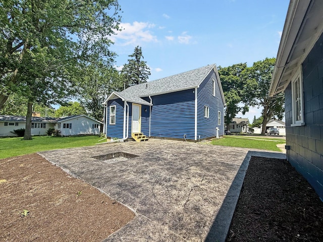 309 W S St, Pearl City, IL 61062 - view of front of home with entry steps, a front lawn, and roof with shingles