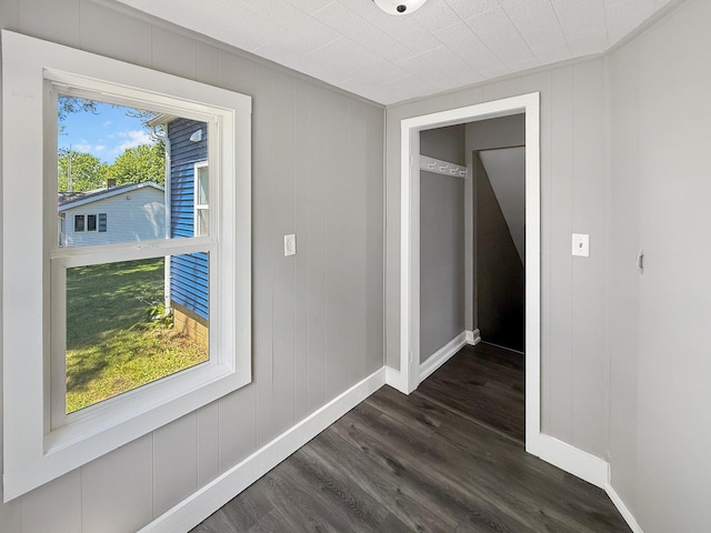 309 W S St, Pearl City, IL 61062 - unfurnished room featuring dark wood-style floors and baseboards