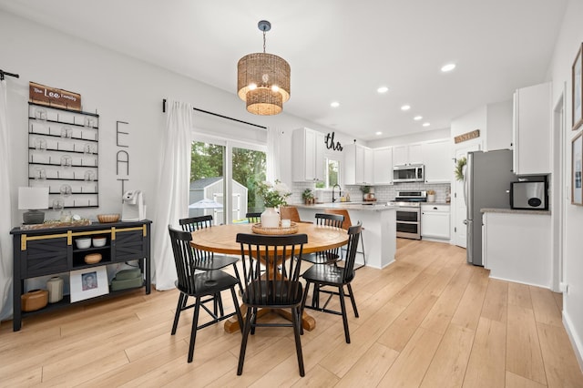 203 Stearn Dr, Genoa, IL 60135 - dining room with light wood-style floors, recessed lighting, and a chandelier