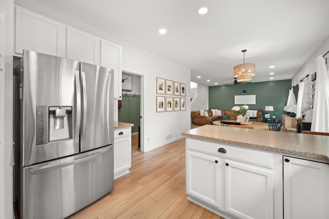 203 Stearn Dr, Genoa, IL 60135 - kitchen with stainless steel refrigerator with ice dispenser, recessed lighting, white cabinetry, and light wood-style flooring
