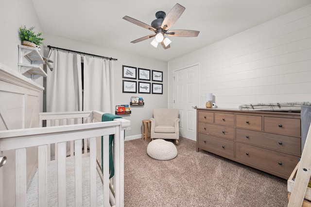 203 Stearn Dr, Genoa, IL 60135 - carpeted bedroom with a crib and a ceiling fan