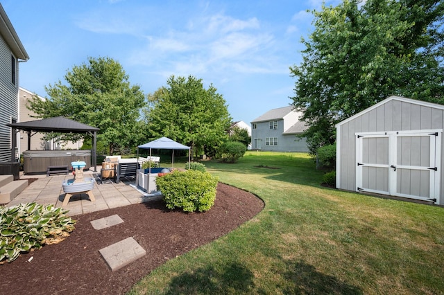 203 Stearn Dr, Genoa, IL 60135 - view of green lawn with a hot tub, a patio, and a shed